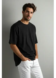 Trendyol Collection تي شيرت أسود كبير الحجم/واسع القطع 100% قطن أساسي بأكمام قصيرة TMNSS22TS0318