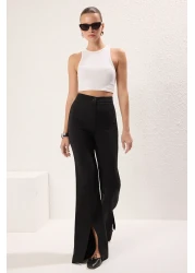 Trendyol Collection بنطال من القماش المنسوج باللون الأسود مع فتحة ساق إسبانية - TWOAW22PL0046
