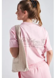 The Champ Clothing تي شيرت نسائي كبير الحجم مطبوع عليه The Wellness Era مصنوع من القطن بنسبة 100%