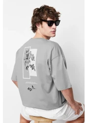 Trendyol Collection تي شيرت قطني واسع القطع مطبوع عليه زهور رمادية - TMNSS21TS1223