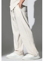 THE RULE بنطال رجالي من قماش الكتان فضفاض وفضفاض وقصة مستقيمة وساق مستقيمة مريح للصيف باللون البيج للموسم الجديد