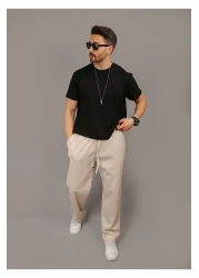 INFLUYENTE بنطال رياضي رجالي بيج فضفاض من قماش بيكيه بخصر مطاطي وجيب مفصل