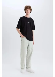 Defacto تي شيرت 100% قطن الفايكنج فالهالا بوكسي بياقة دائرية وطباعة خلفية وأكمام قصيرة E3277AX25SM