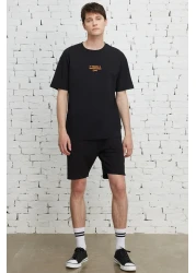 AC&Co / Altınyıldız Classics تي شيرت رجالي أسود بقصة ضيقة وياقة دائرية مصنوع من القطن بنسبة 100%