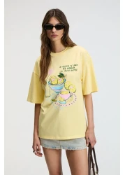 GRIMELANGE تي شيرت نسائي من NITZA مصنوع من القطن بنسبة 100% برقبة دائرية كبيرة الحجم باللون الأصفر