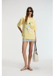 GRIMELANGE تي شيرت نسائي من NITZA مصنوع من القطن بنسبة 100% برقبة دائرية كبيرة الحجم باللون الأصفر