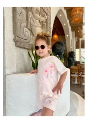 Next Baby طقم علوي من Laciel Paris من التول الوردي الناعم مع شورت بأكمام قصيرة