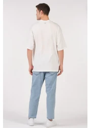 to COSMOS تي شيرت للجنسين (رجال - نساء) مقاس كبير (فضفاض-سلاش) لون إكرو (أبيض) لا تقدم أبدًا