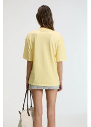 GRIMELANGE تي شيرت نسائي من NITZA مصنوع من القطن بنسبة 100% برقبة دائرية كبيرة الحجم باللون الأصفر