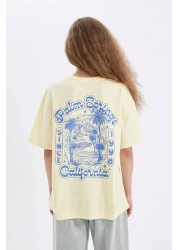 Defacto تي شيرت كبير الحجم بأكمام قصيرة ورقبة دائرية وطباعة خلفية D4929ax24au